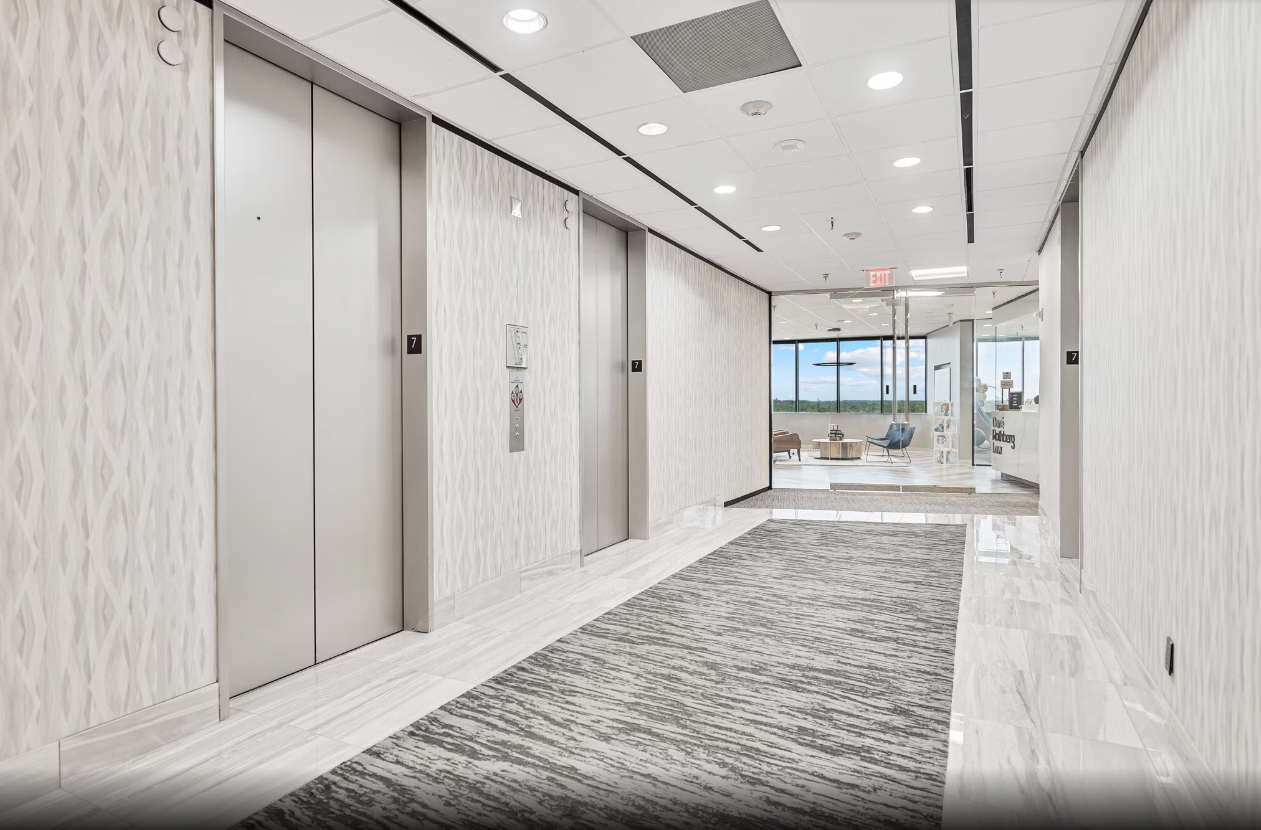Building entrance foyer with floor-to-ceiling windows
